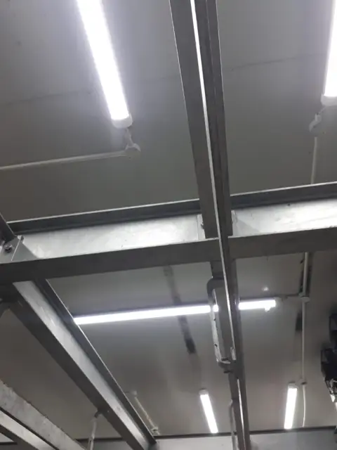 LED tube lighting on steel trusses at La Oma Butchery